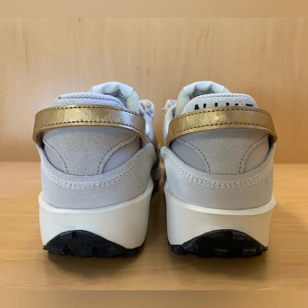 Nike Women's Light Gray Sneakers with Mustard Swoosh